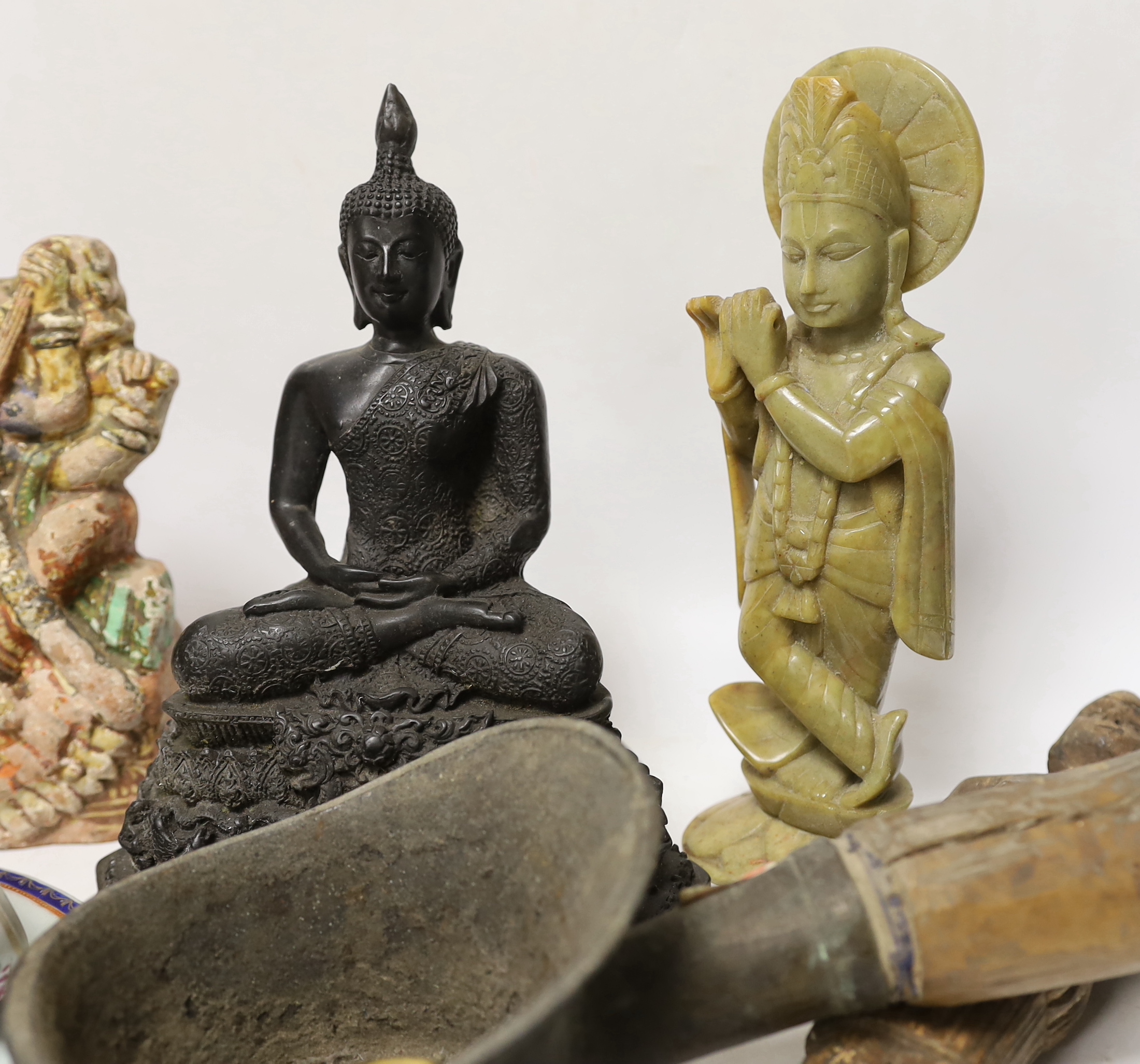 A Thai composite Buddha, 22cm high, an African carved wood female figure, an iron, a small bronze Buddha, an Indian soapstone carved figure of Krishna and a terracotta figure of Saraswati, together with Chinese ceramics,
